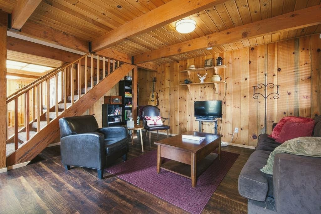 The main living room is a great spot to relax by the fire. Sofa pulls out to a queen sized bed.