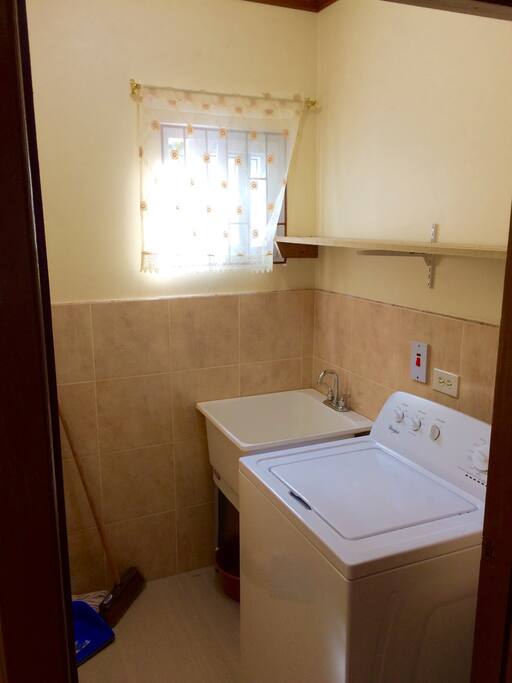 A separate wash room with laundry.