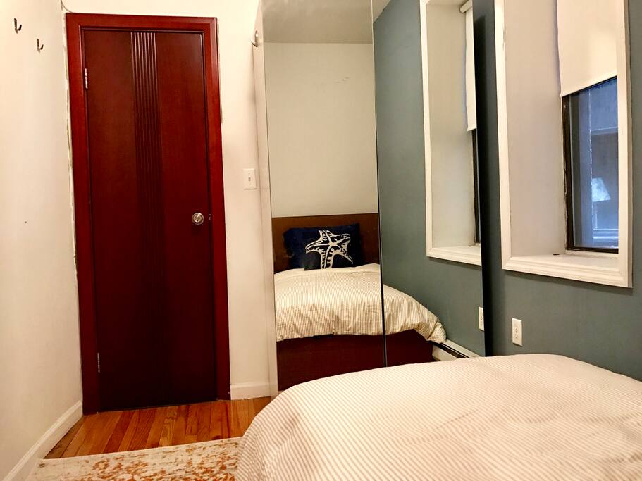 That's the door of the bedroom (your own bedroom) and the closet with mirrors.