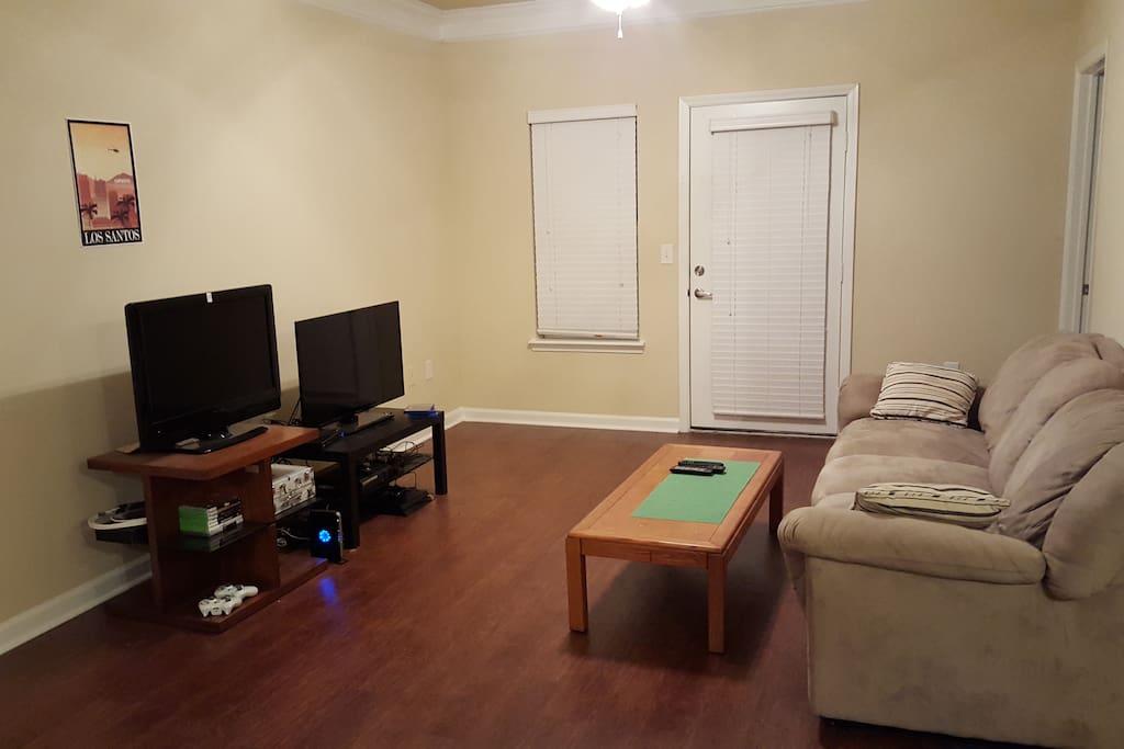 living room with couch, 40" TV, and Xbox 360