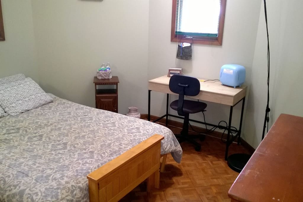 Desk and fan in room
