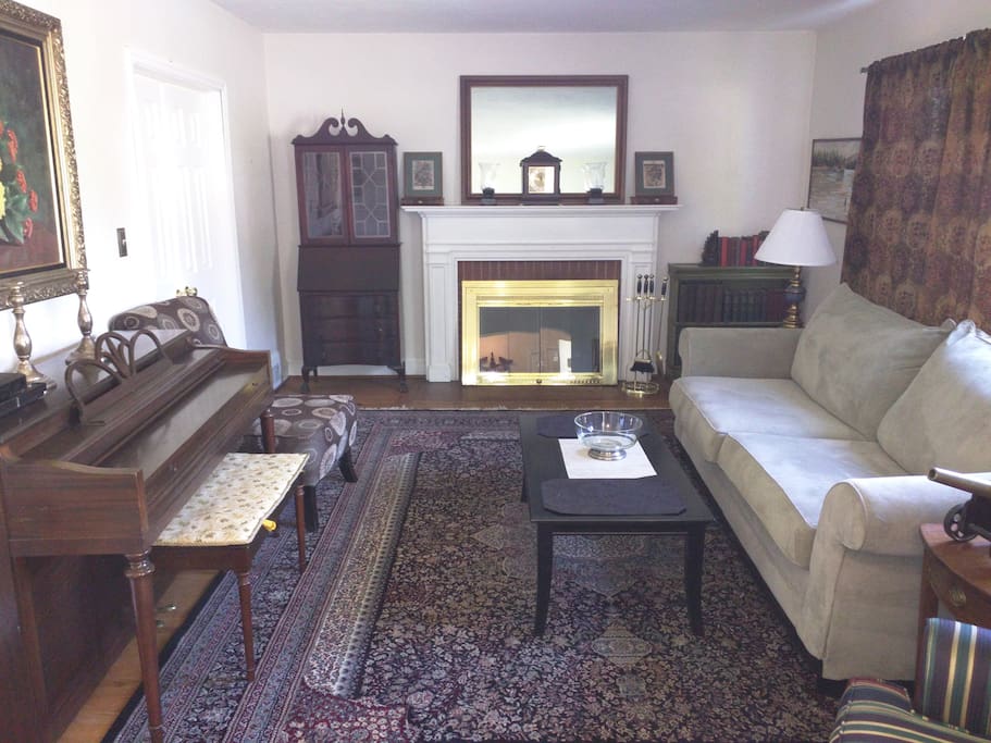 Elegant Victorian living room with working fireplace.