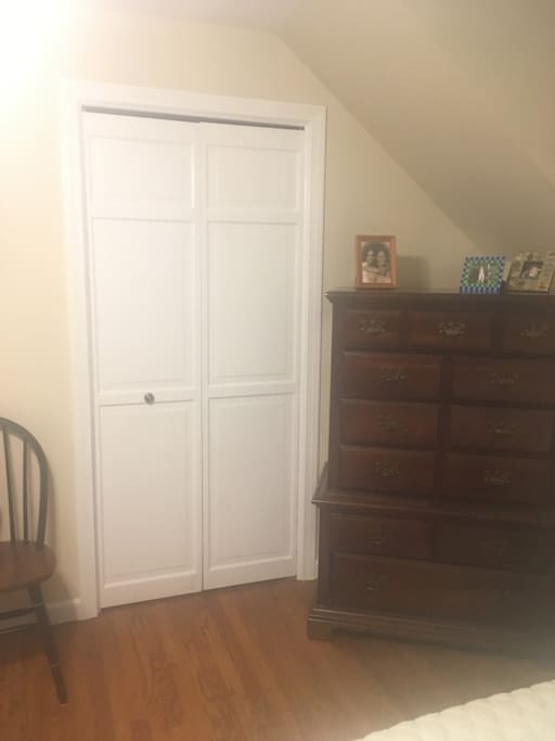 Dresser and closet space in bedroom 1.