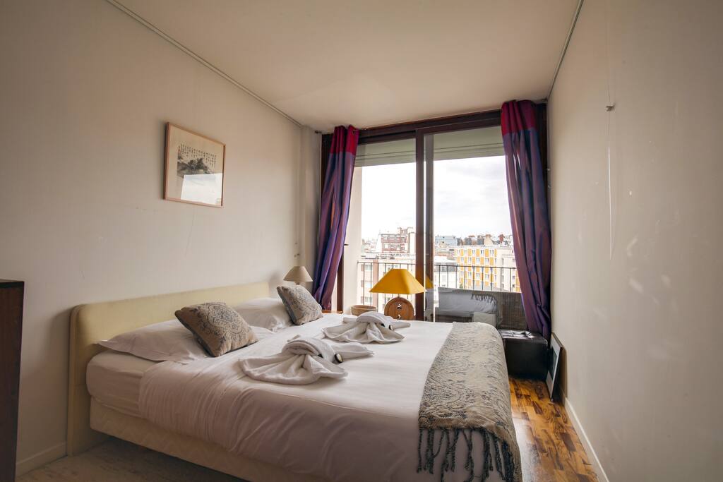 The bedroom offering a way to the Balcony