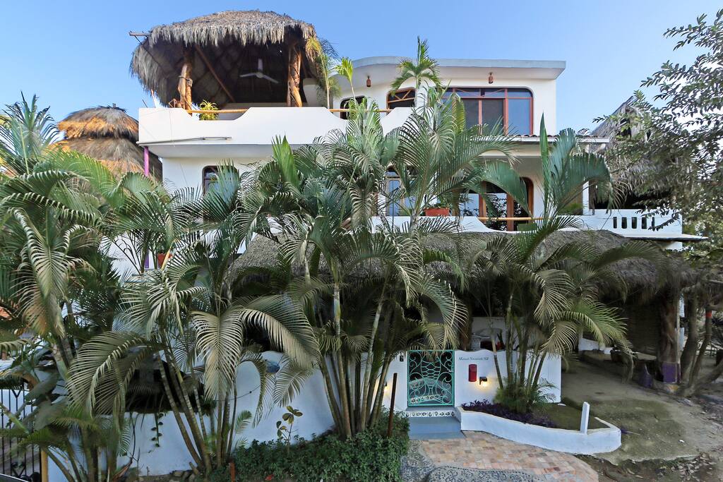 Casa Suenos del Mar front view with Penthouse palapa terrace prominent