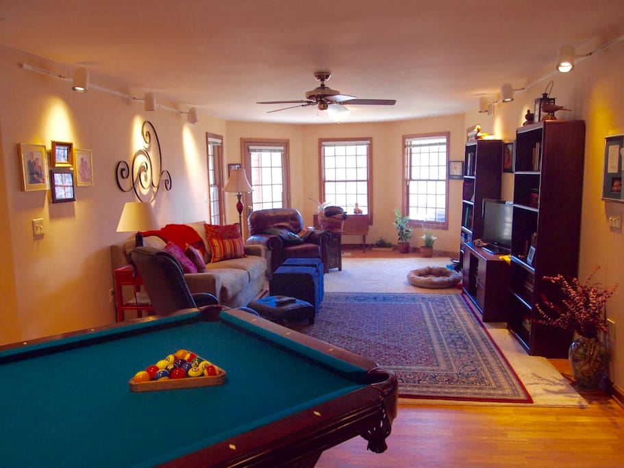 View of main living area with views of lake and pool table