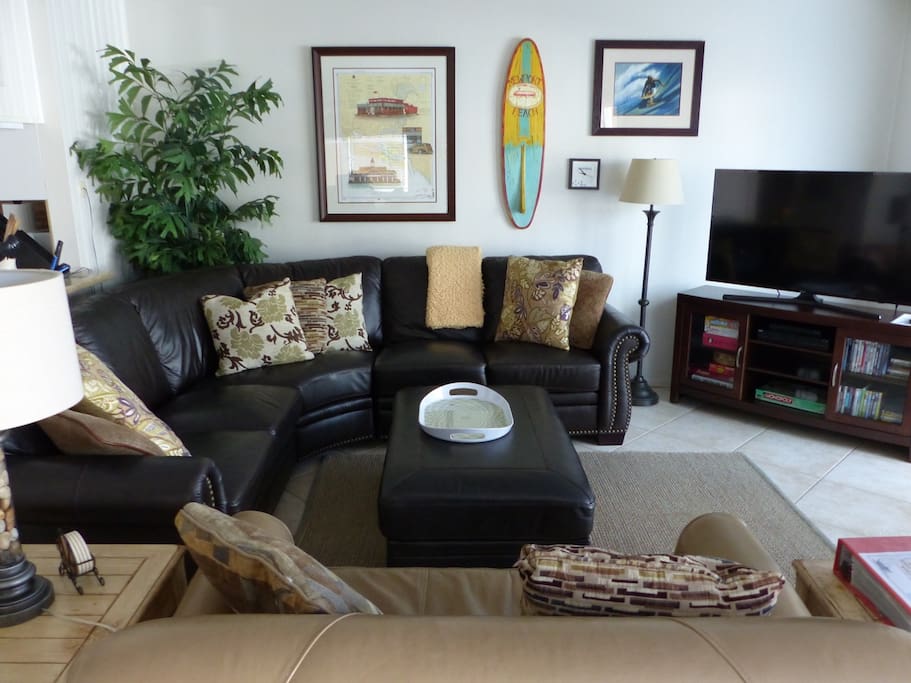 Living Room, so comfortable w/2 leather couches and a new flat screen and furniture console