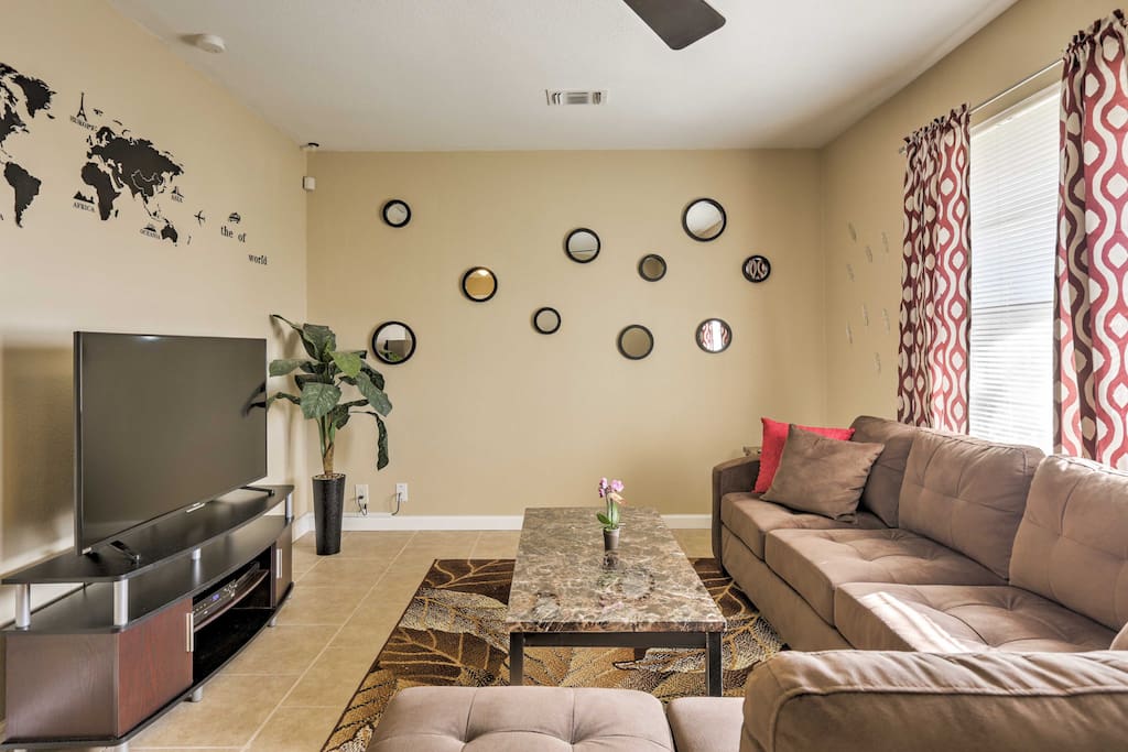 The cozy living room offers comfortable furnishings, creating the ideal space to relax after a long day.