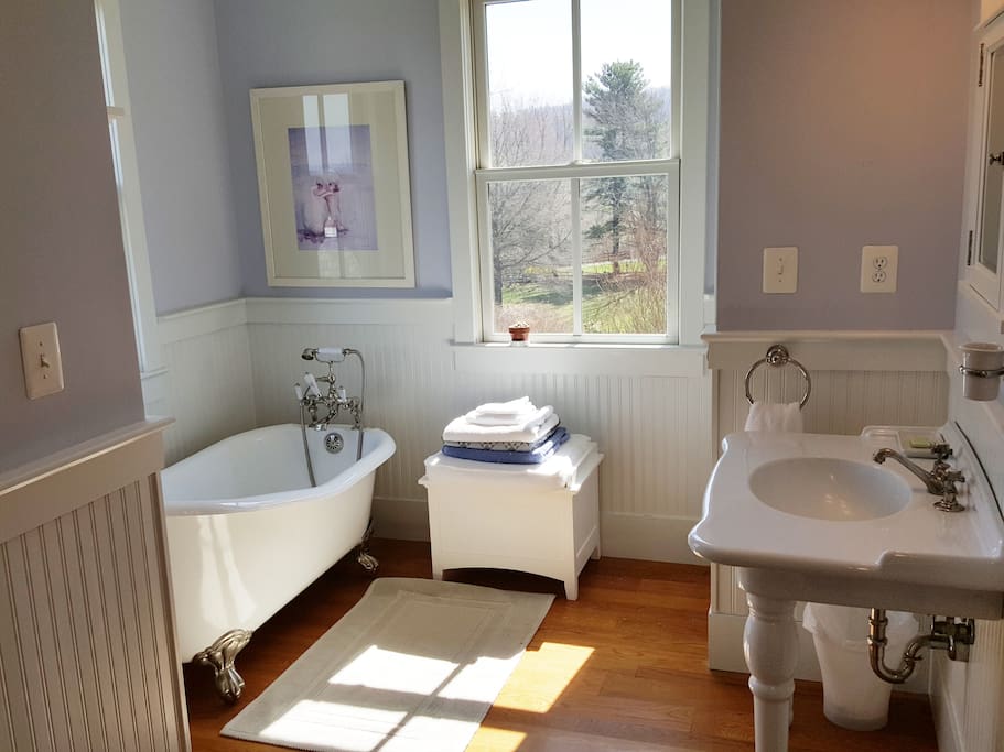 Large corner bathroom connects the upstairs guest rooms.