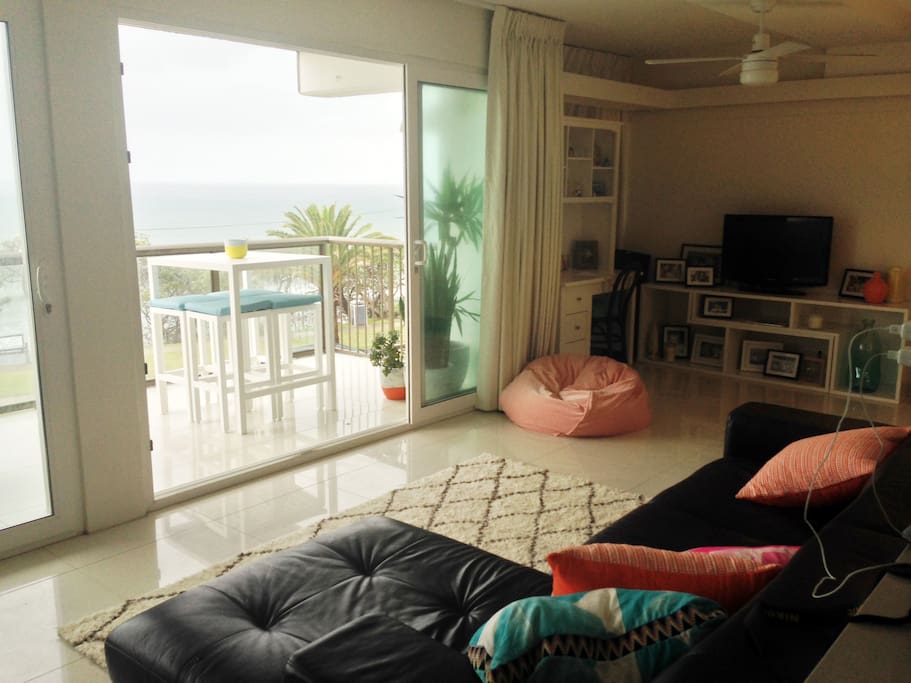 Modern open plan with views to beach from couch :)