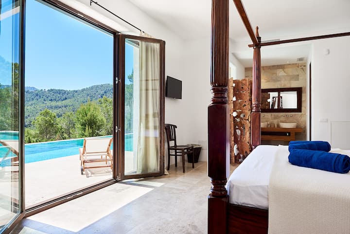 Bedroom 1 with outstanding views and private pool terrace with sunloungers and Bali bed 