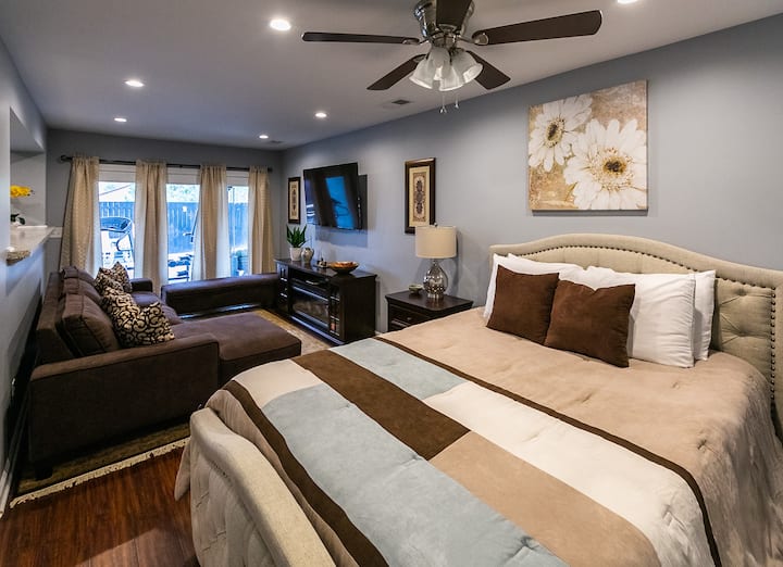 Lower level queen bedroom with sitting area and fireplace