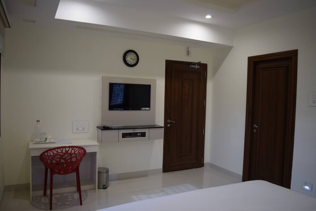 A television unit and a work desk.