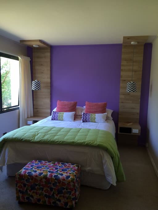 East facing bedroom with a peaceful garden view