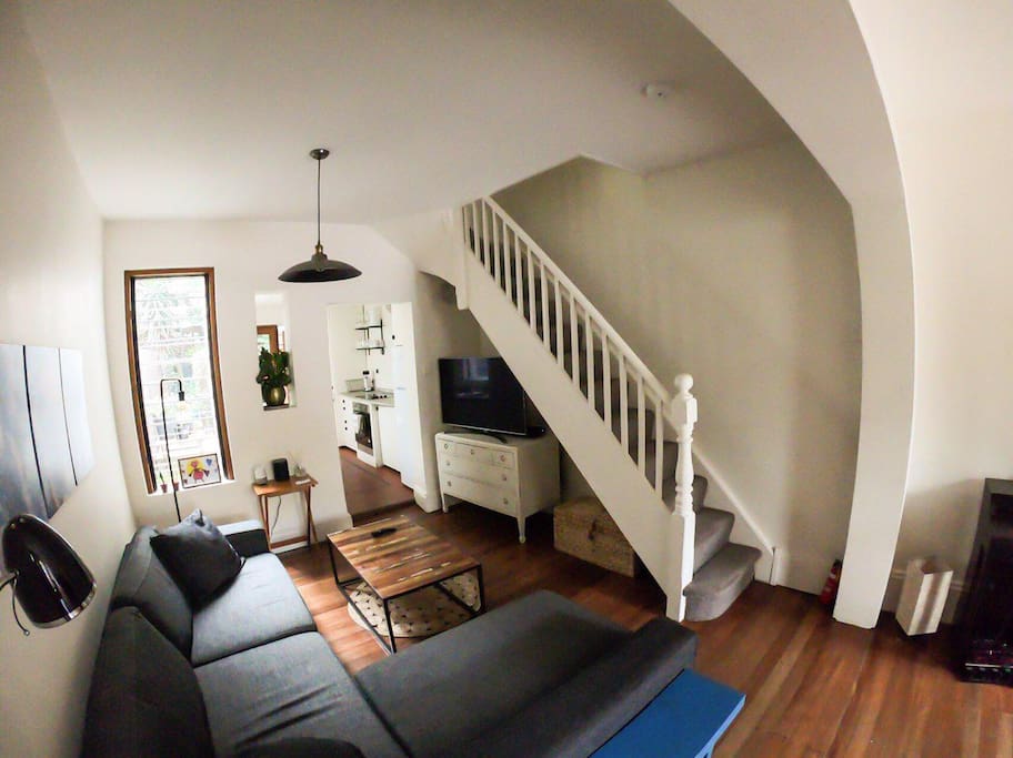 Living room (including 4K TV with Netflix) with a sneak peak to the kitchen