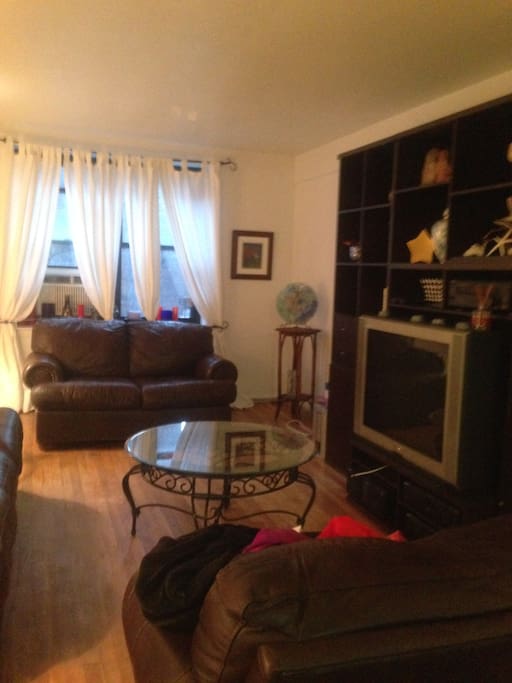 Living room very spacious, confortable and make you feel like home.