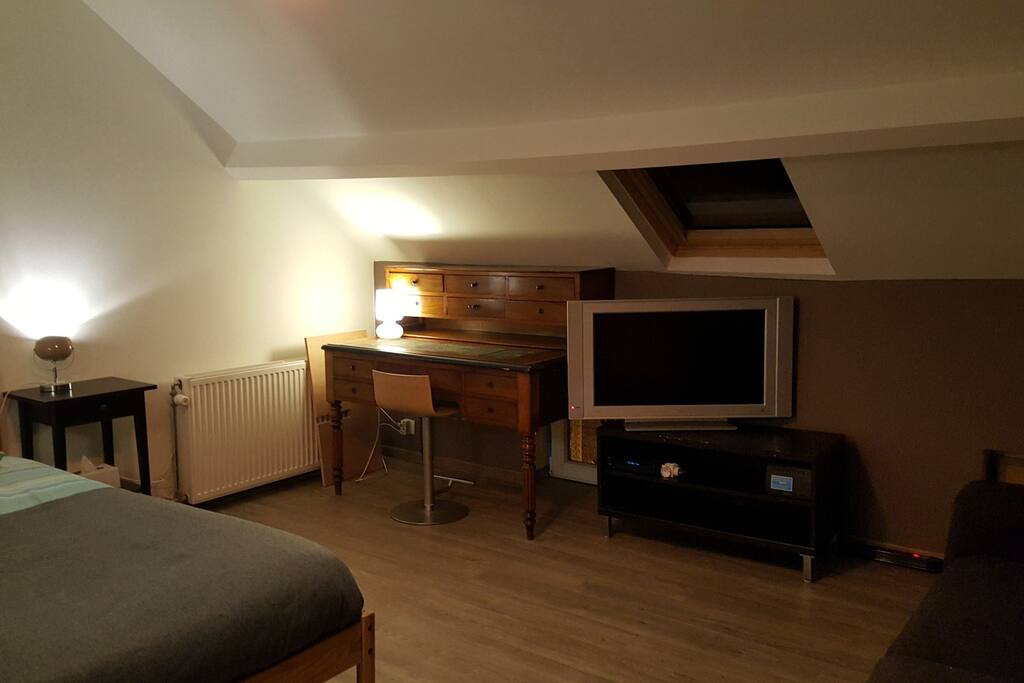 A desk ah available in the room.
