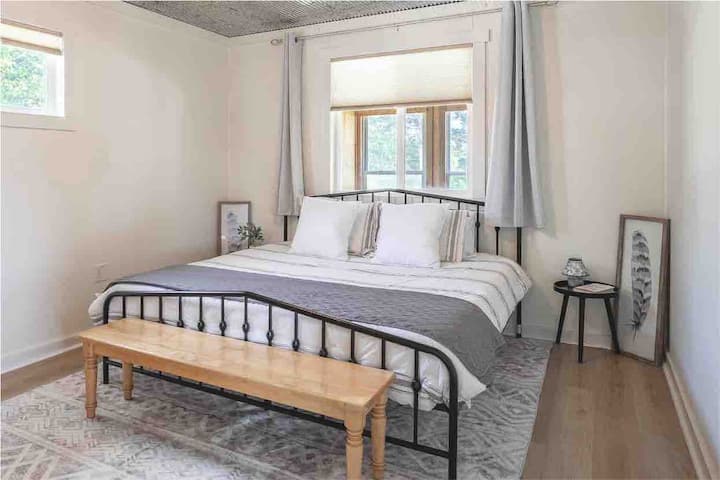 Primary bedroom with king bed. 