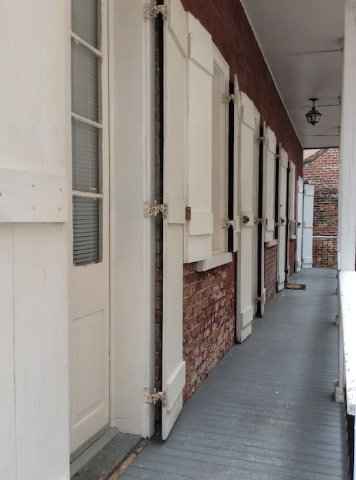 Architectural shutters on every door and window, each overlooking your private patio courtyard