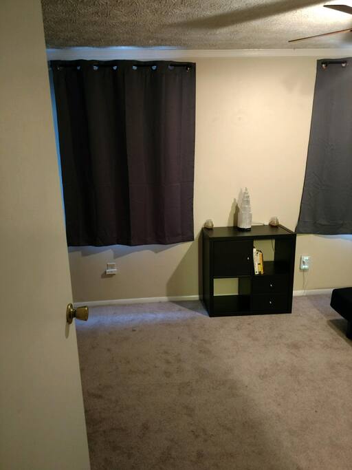 Two drawers, a cabinet and two cubes for storage, in addition to the bedside shelves and closet.