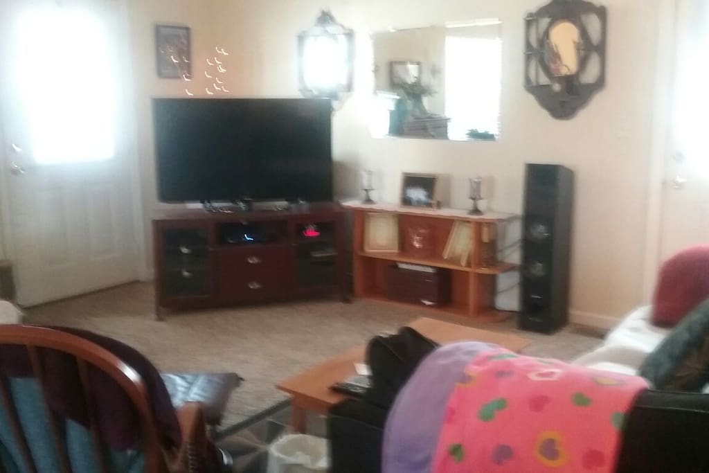 part of open area with kitchen behind