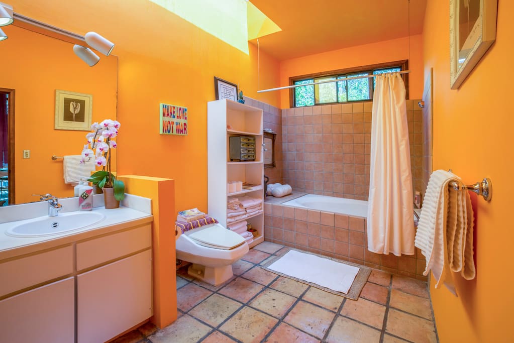 Beautiful large light and bright bathroom featuring large tub and European style shower.