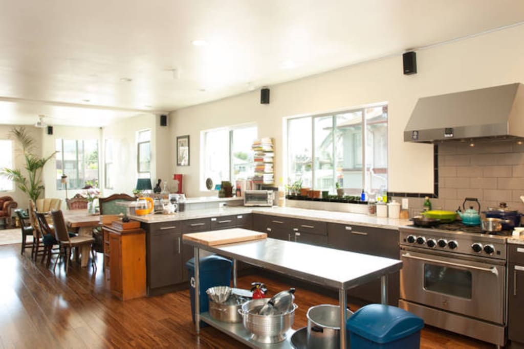 Epic Kitchen With Industrial Stove and Two Refridgerators