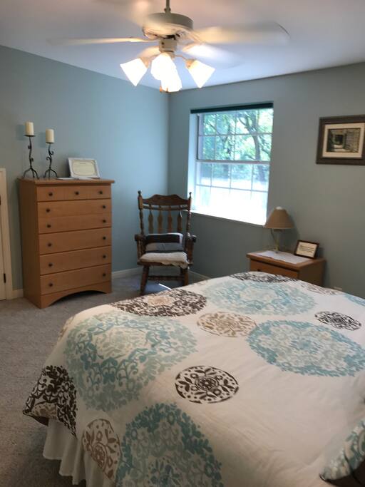 Corner with rocker, chest of drawers and nightstand.