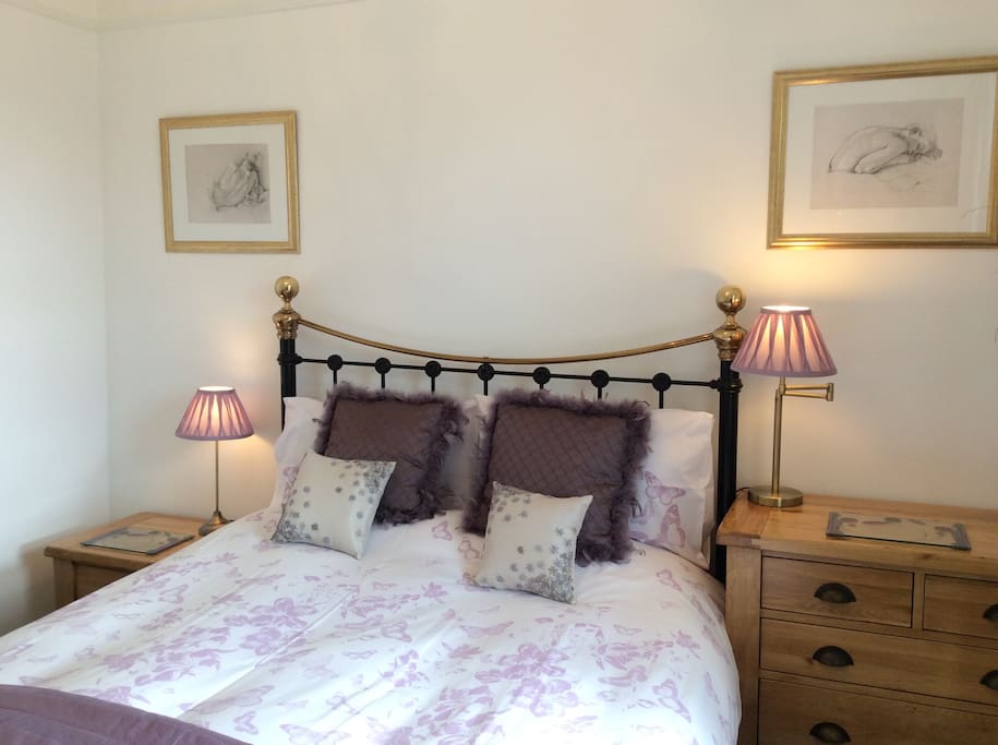 Light and airy bedroom with plenty of storage.