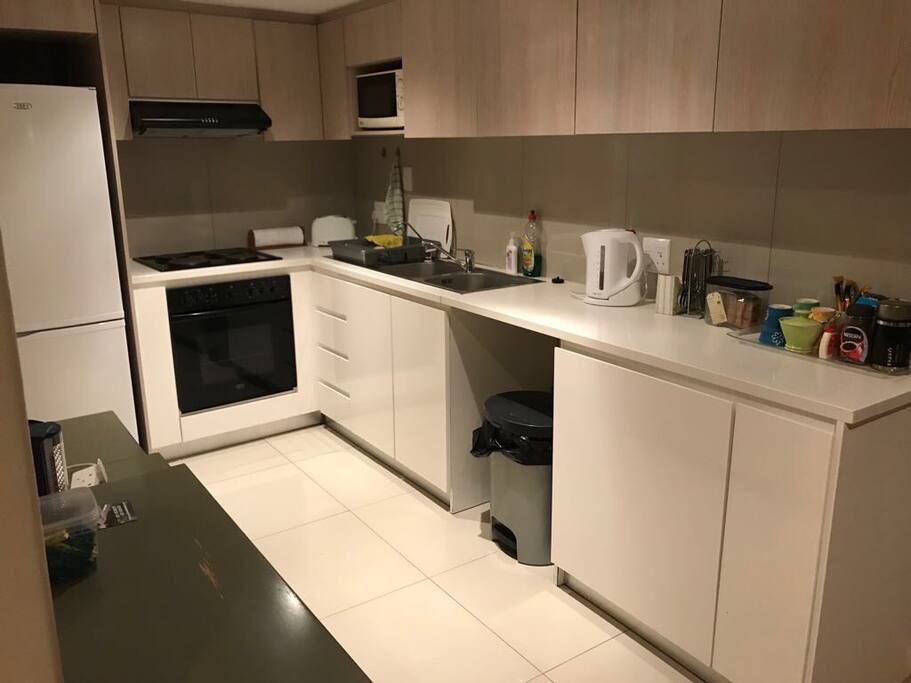 Fully equipped kitchen with all appliances including Nespresso machine.