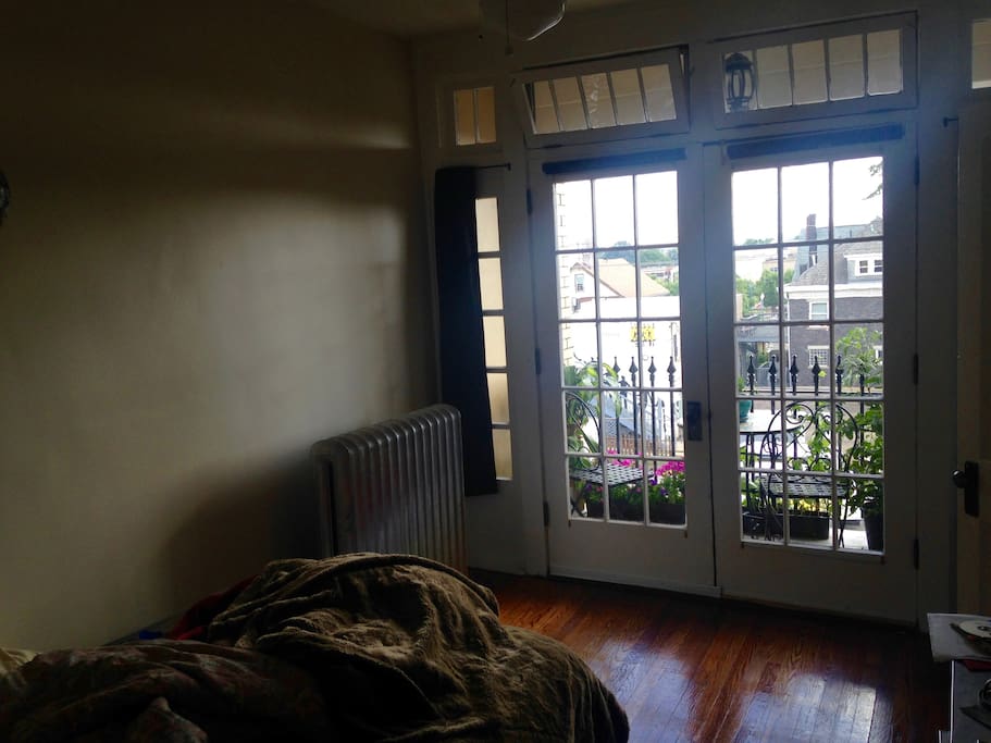Bedroom with french doors opening onto veranda