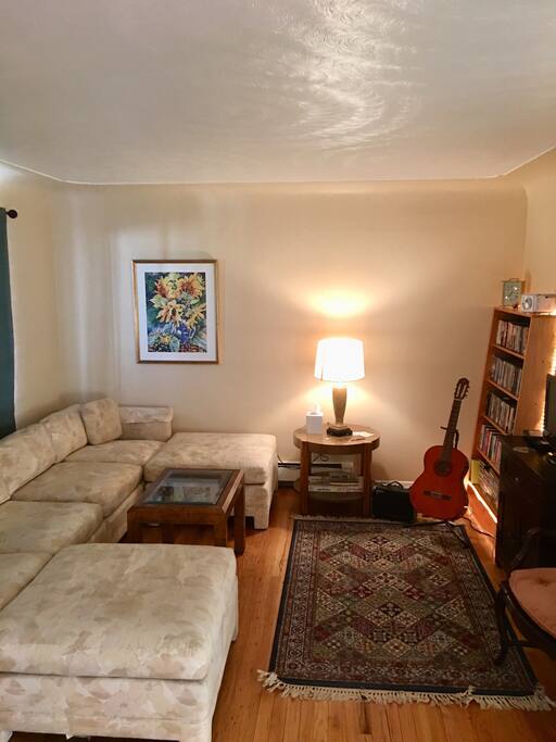 Living room , large sectional couch, guitar included:)