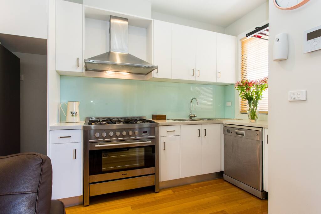 Kitchen with Blanco stainless steel 5 burner chef’s oven / stove & dishwasher