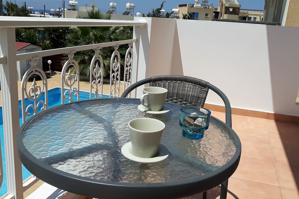Our balcony facing the pool, ideal for a morning coffee or an evening glass of wine.