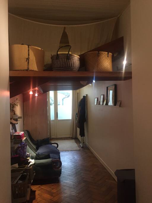 Corridor with mezzanine bed on top