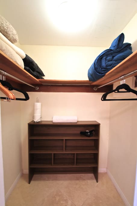 Master closet, complete with extra pillows and blankets.