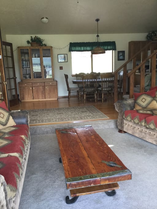 View from living room into dining area. Open floor plan and celestial windows bring plenty of light into the house.