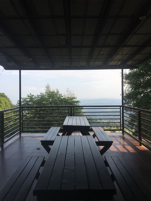 Common area where guests can relax and read a book whilest enjoying the view of taal lake and valley