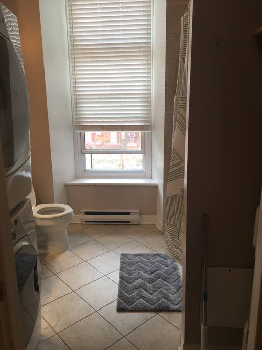 Bathroom with washer and dryer.