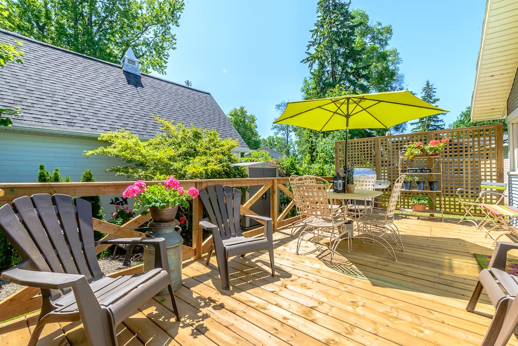 Beautiful side deck offers seating, privacy and BBQ space