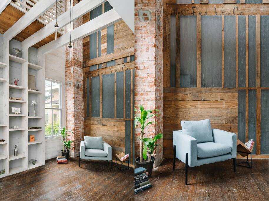Translucent stair wall and front brick chimney, viewed from entry.