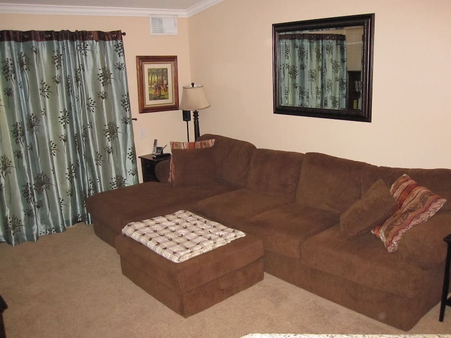 Full size couch with chaise lounge seat and ottoman