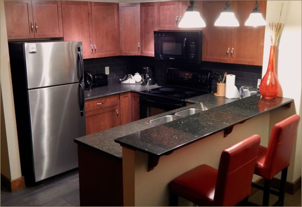 Modern, sleek kitchen with stainless steel appliances