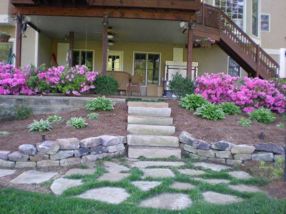 Private Underdeck Patio: View from Yard to Covered Patio and Apartment