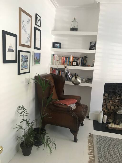 The snug as we affectionately call it. Extremely cosy during cold winter months but lovely and airy in the summer; boasting stylish plantation shutters, original fireplace, fireside chair with leg rest accompanied by lots of reading material.