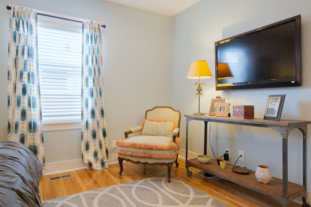 Another view of cozy bedroom with flat screen TV