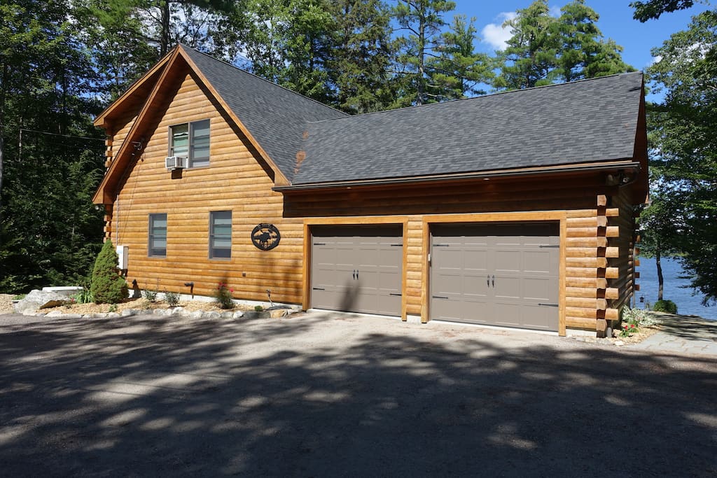 Just 15 minutes from downtown Portland, enjoy your time in Southern Maine on the shores of Highland Lake. Your parking spot is just there, to the right of the garage next to the stone path.