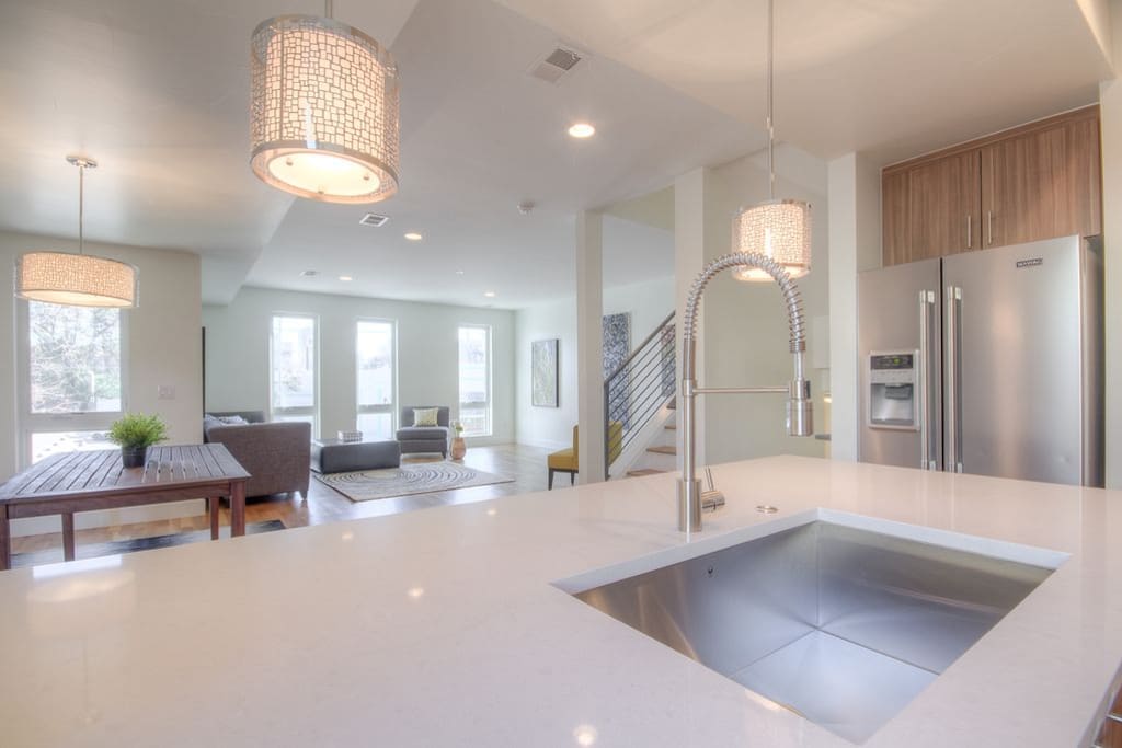 Main living area. Currently has dining table for 4-6 and counter seating for 4