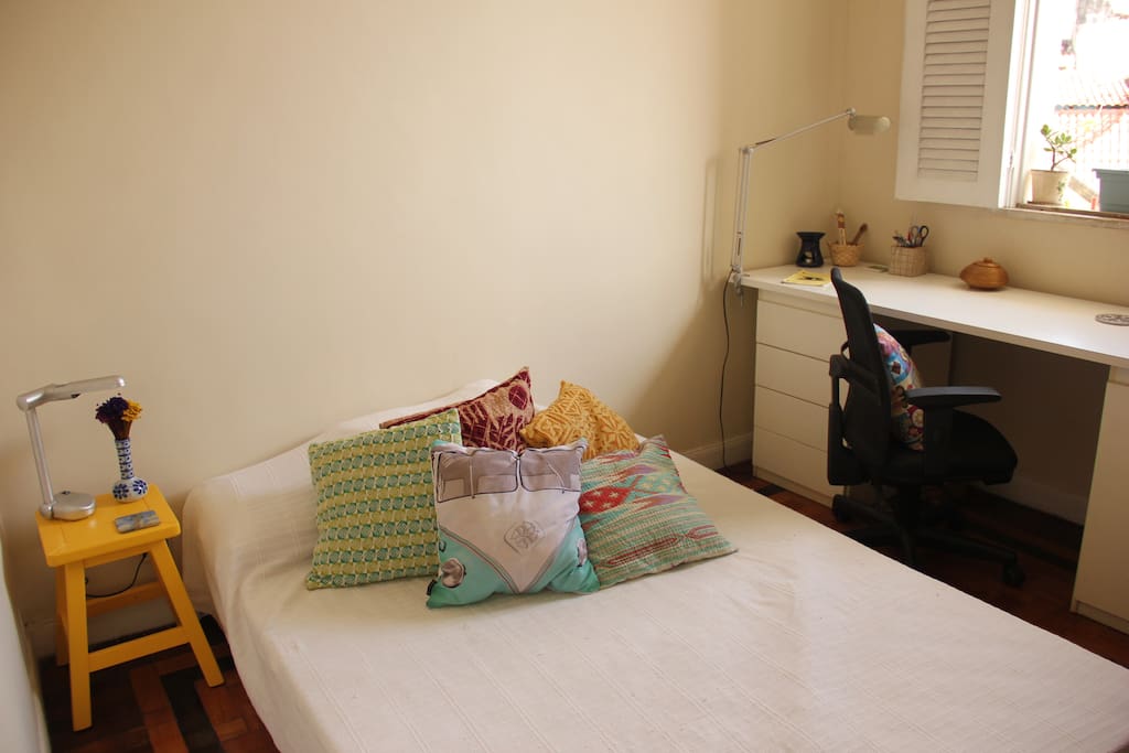 Your room with a queen bed and desk
