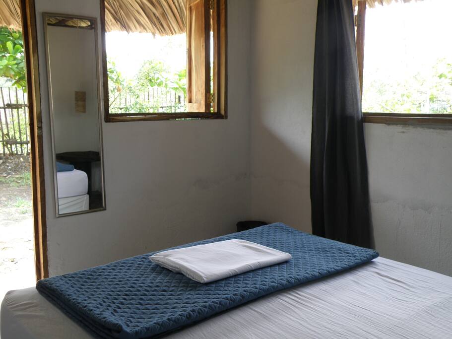 Two windowns provide the sea breeze to come in and you can hear the waves from this corner room.